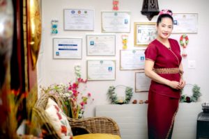 Atipa and the wall of her diplomas
